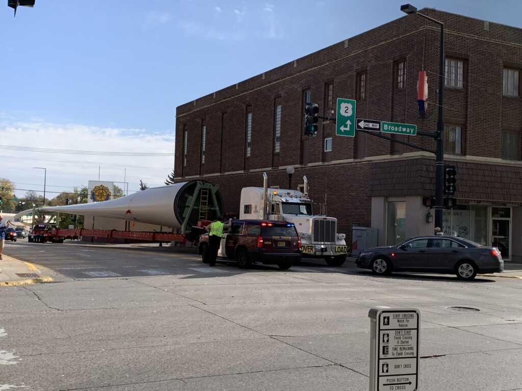 SEMI PULLING WIND TURBINE HAS TO BACK THROUGH CROOKSTON AFTER BEING UNABLE TO MAKE TURN