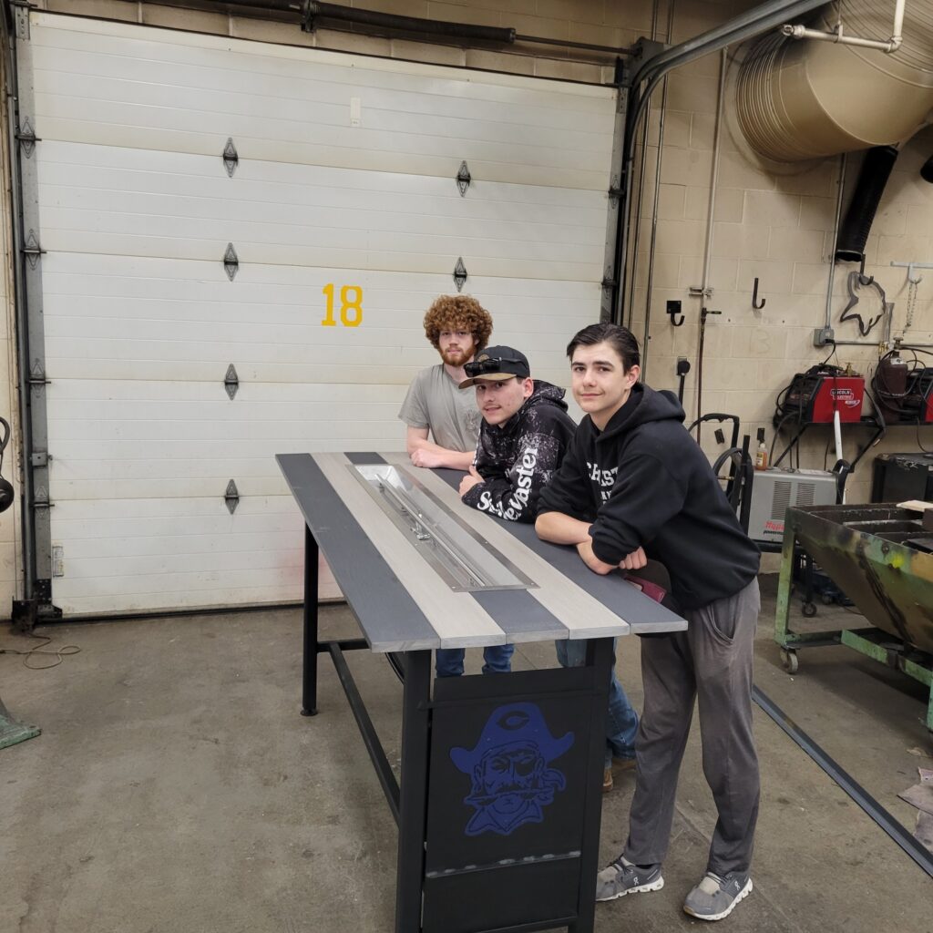 CROOKSTON HIGH SCHOOL INDUSTRIAL TECH STUDENTS CREATE A FIRE TABLE FOR A RAFFLE