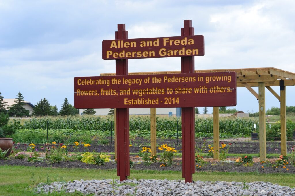 TAKE TIME TO SMELL THE FLOWERS AND VISIT THE ALLEN AND FREDA PEDERSEN COMMUNITY GARDEN