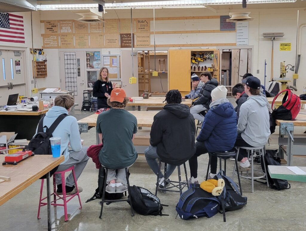 Admissions Specialist from ATCC visits with Crookston High students