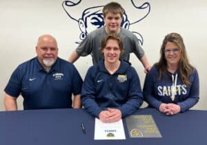 Teagen Lubinski signs to play football at St. Scholastica