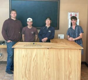 Crookston High School Community Projects class completes desk project for Cathedral of the Immaculate Conception as school year concludes