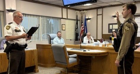 Polk County Board gets monthly sheriff’s report, witnesses swearing-in of new deputy during recent meeting