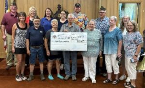 The Crookston Masonic Lodge and Order of the Eastern Star present a donation check to Honor Flight of North Dakota and Minnesota