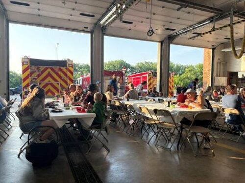 Crookston firefighters serve up breakfast during Ox Cart Days