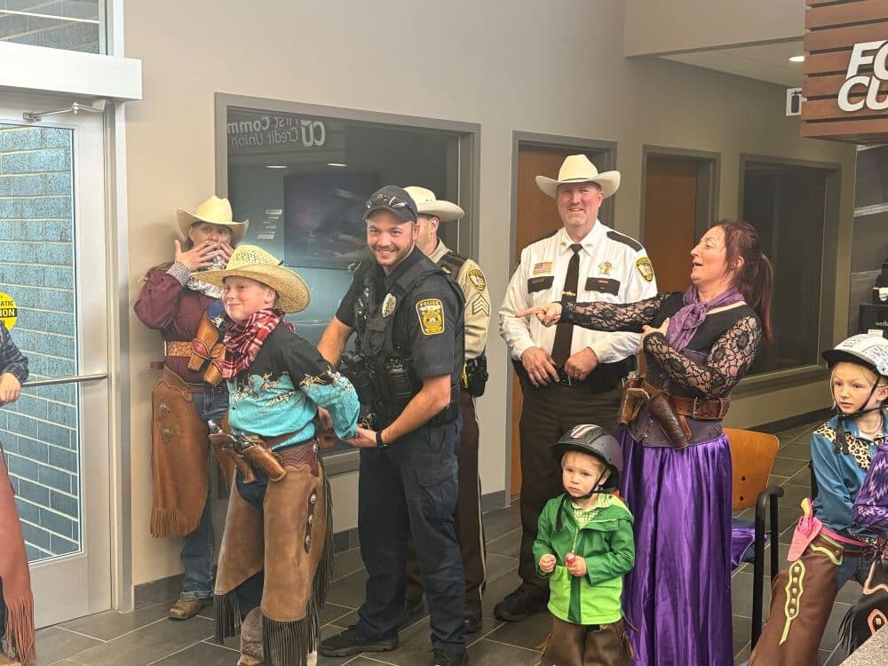 Wild Rice Peacemakers conduct a mock bank hold-up ahead of their Spooktacular Shoot in Crookston on Saturday and Sunday